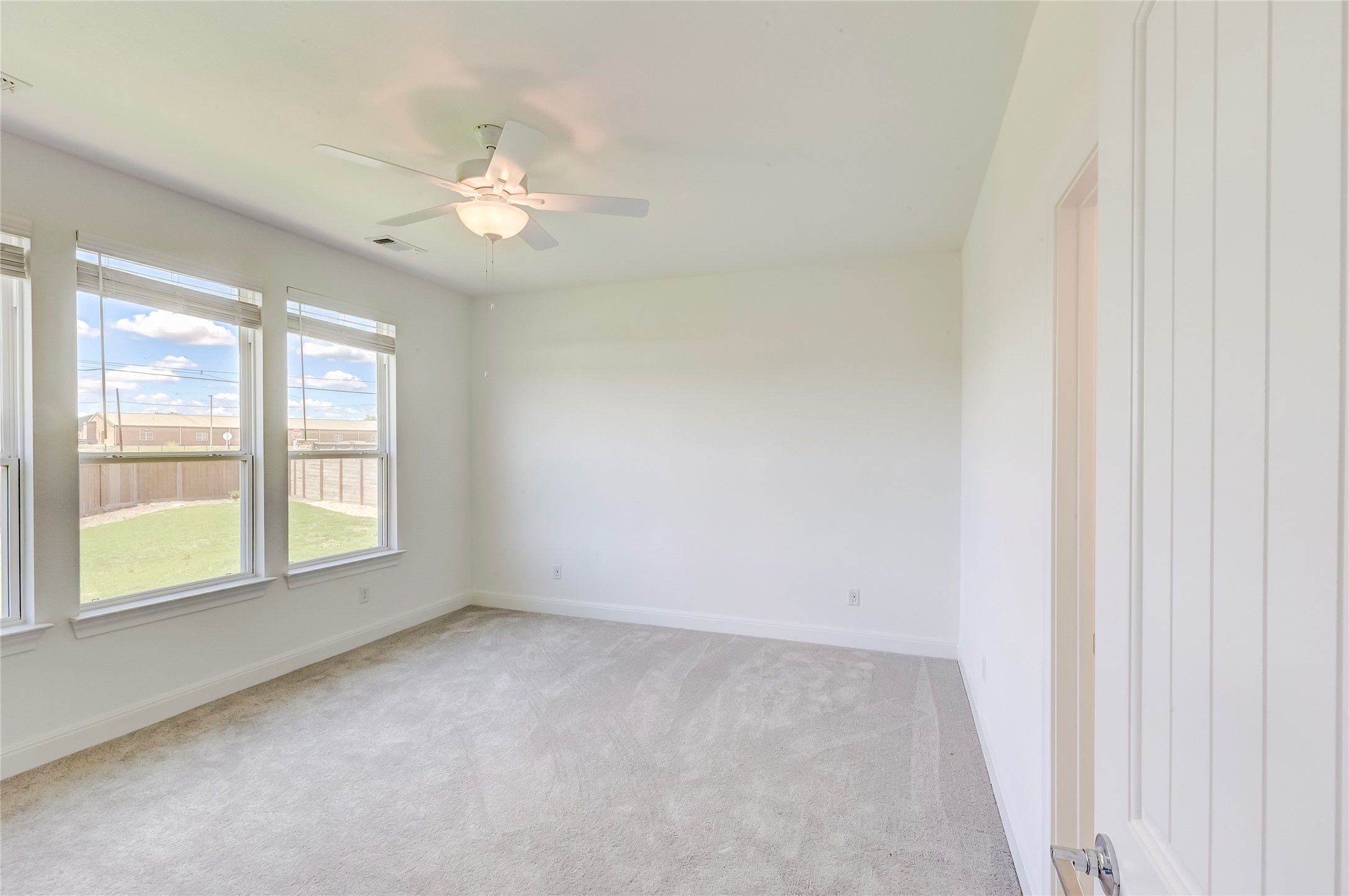 132 Inlet Lane Leander, TX 78641 - Photo 17 of 36 Unfurnished room featuring a ceiling fan and light colored carpet