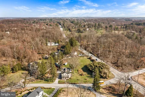 an aerial view of a residential houses with outdoor space