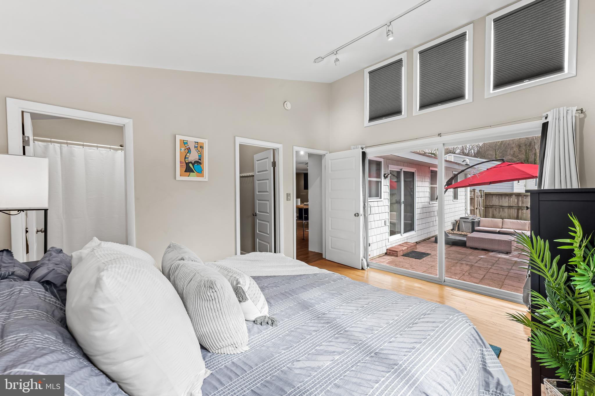 127 Cresston Road Arnold, MD 21012 - Photo 13 of 32 a bedroom with a bed and a potted plant