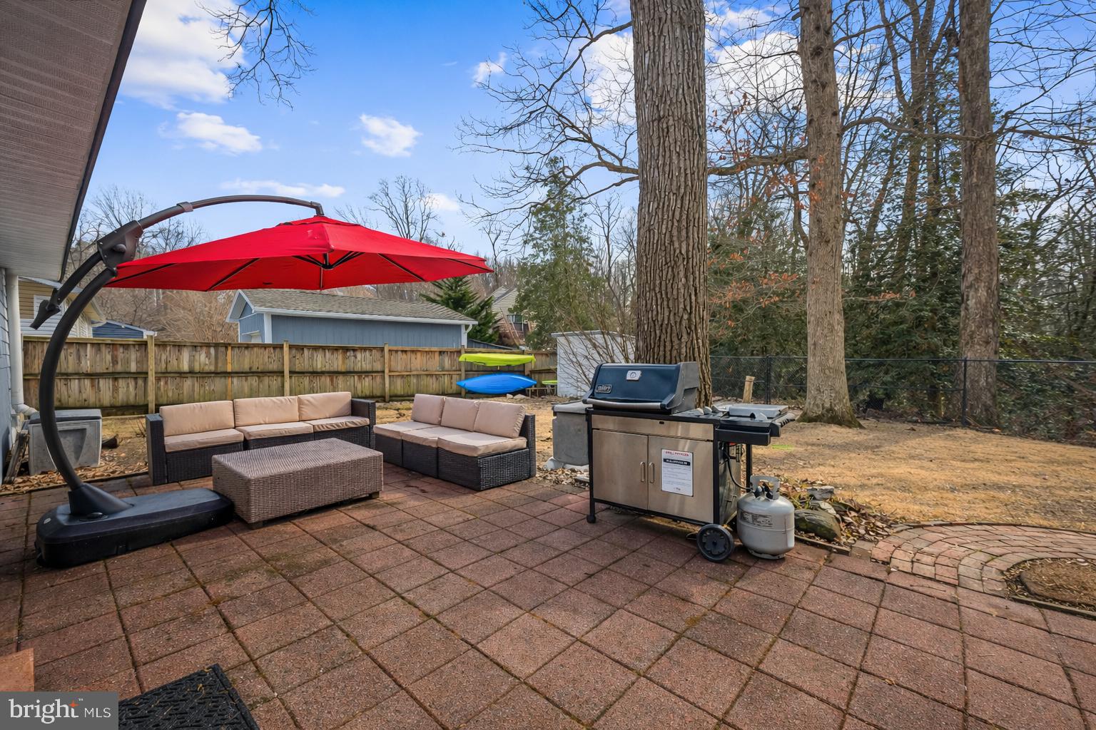 127 Cresston Road Arnold, MD 21012 - Photo 14 of 32 a patio with patio a fire pit and couch