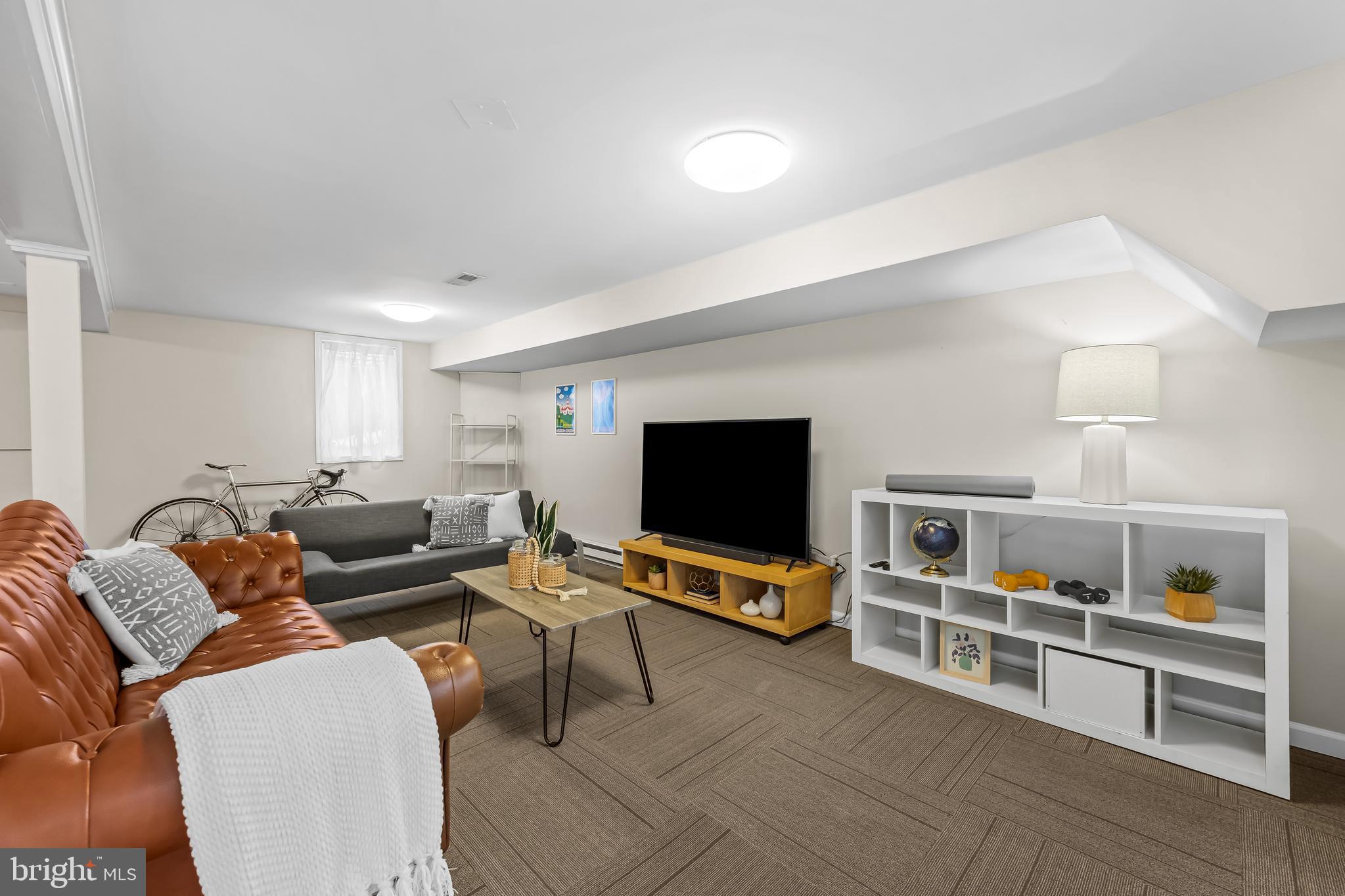 127 Cresston Road Arnold, MD 21012 - Photo 22 of 32 a living room with furniture and a flat screen tv