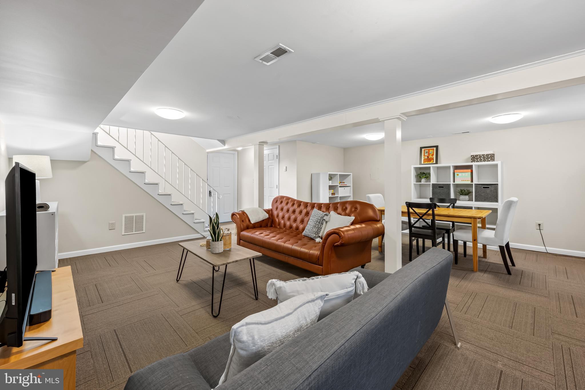 127 Cresston Road Arnold, MD 21012 - Photo 23 of 32 a living room with furniture and a flat screen tv