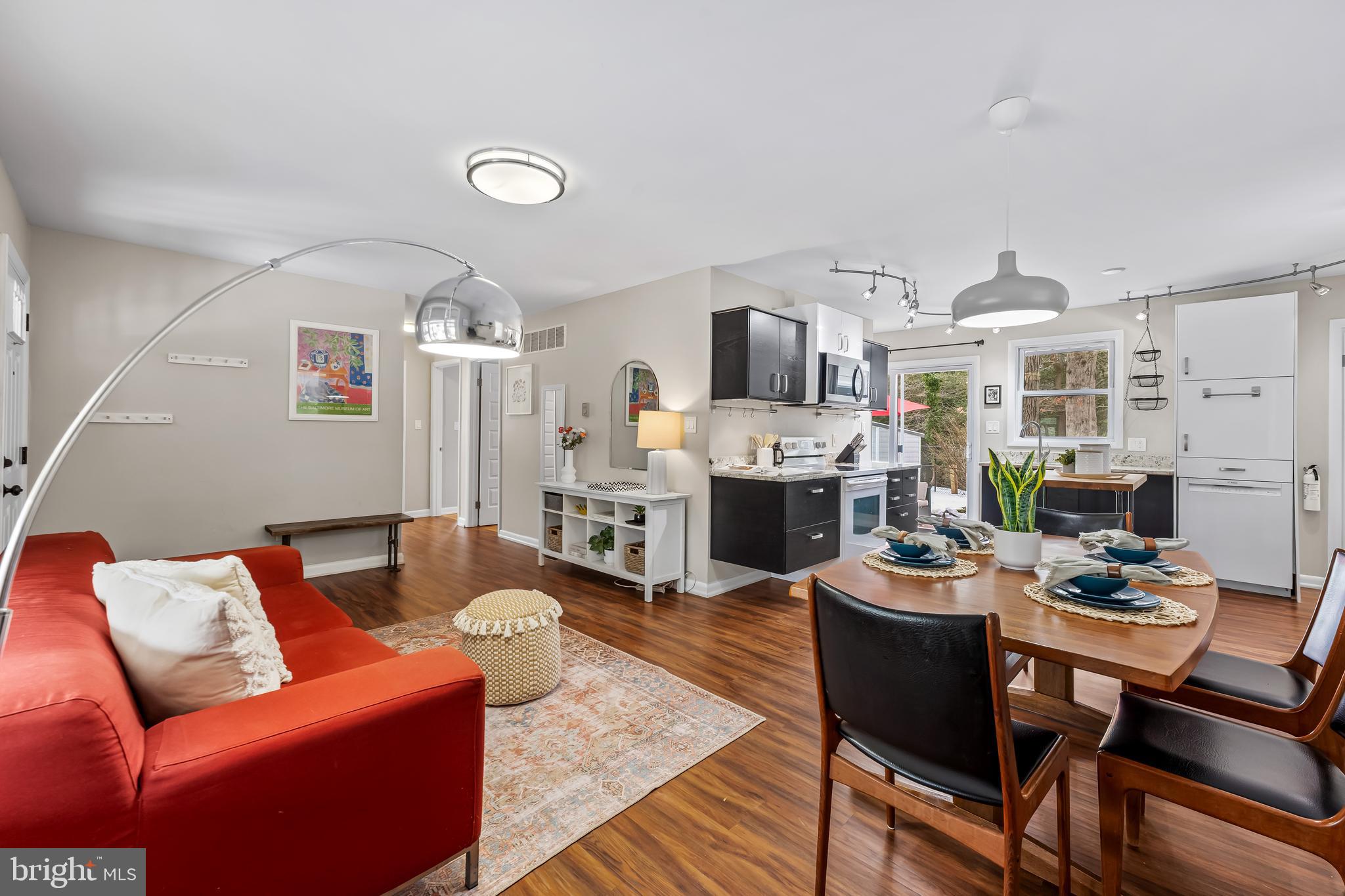 127 Cresston Road Arnold, MD 21012 - Photo 5 of 32 a living room with furniture a fireplace and a flat screen tv