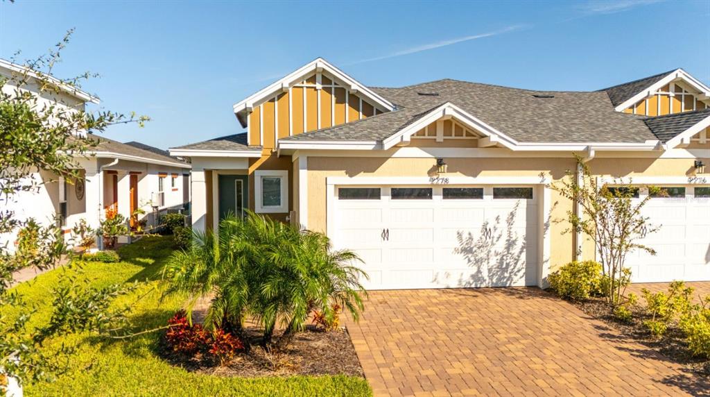 2278 Datura Loop St. Cloud, FL 34772 - Photo 1 of 31 a view of a white house with a small yard and potted plants