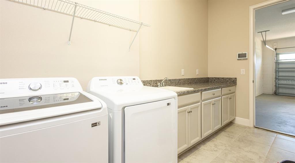 2278 Datura Loop St. Cloud, FL 34772 - Photo 14 of 31 a utility room with dryer and washer