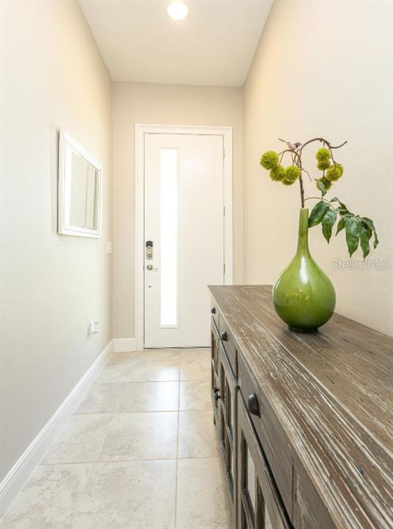 2278 Datura Loop St. Cloud, FL 34772 - Photo 5 of 31 a kitchen with a table and a potted plant