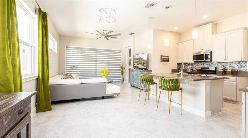 2278 Datura Loop St. Cloud, FL 34772 - Photo 6 of 31 a kitchen with counter top space and appliances