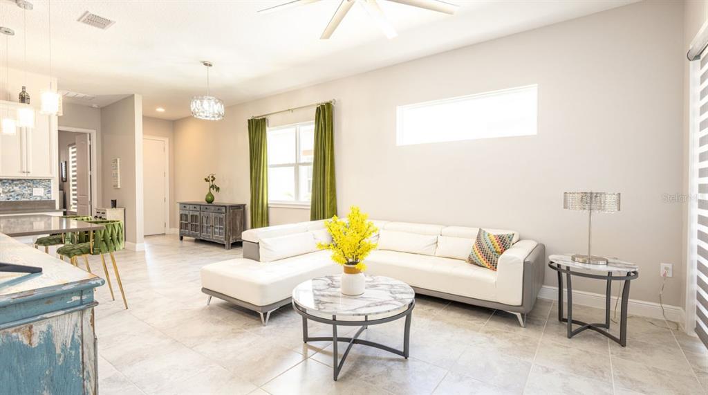 2278 Datura Loop St. Cloud, FL 34772 - Photo 8 of 31 a living room with furniture and a couch