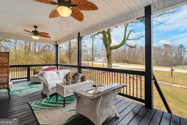 a view of a porch with furniture
