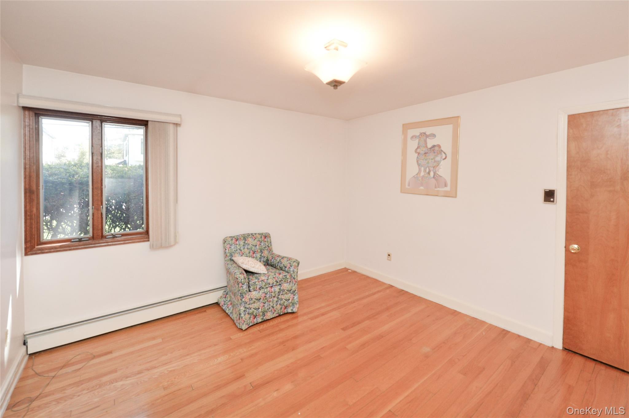 24 Highview Road Monsey, NY 10952 - Photo 23 of 44 a view of empty room with wooden floor and fan