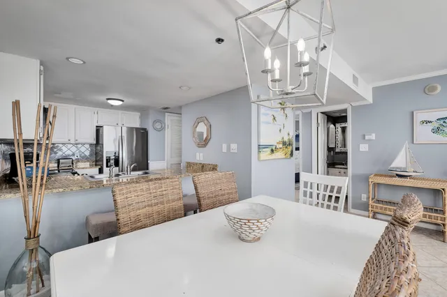 a kitchen with stainless steel appliances granite countertop a sink a stove a microwave a refrigerator and cabinets