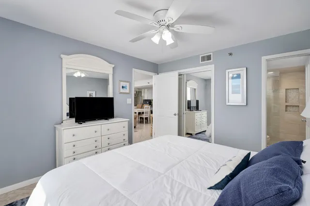 a bathroom with a sink toilet a mirror and shower