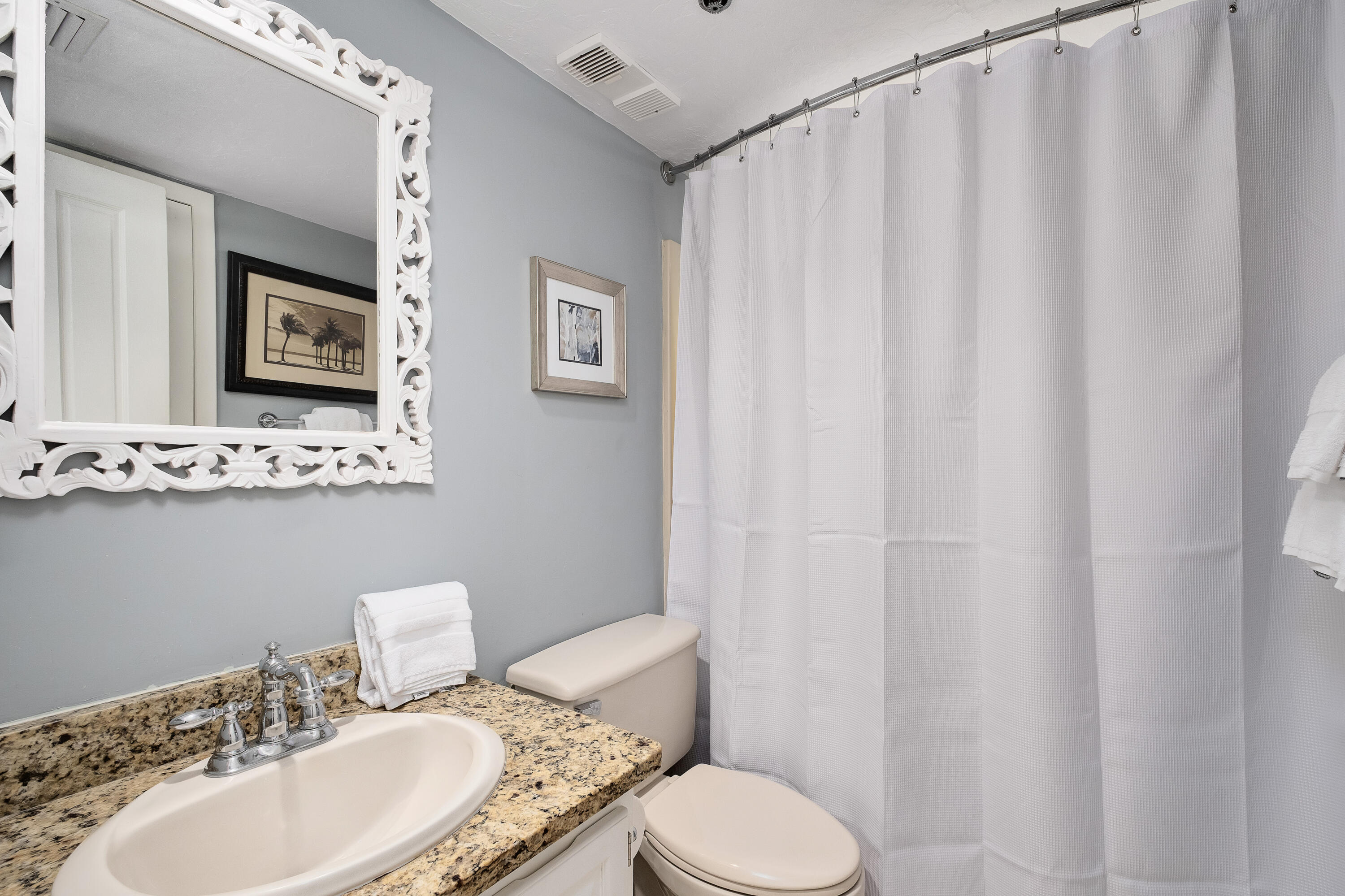 4100 East County Highway 30A, Unit 902 Santa Rosa Beach, FL 32459 - Photo 22 of 54 a bathroom with a toilet a sink and a mirror