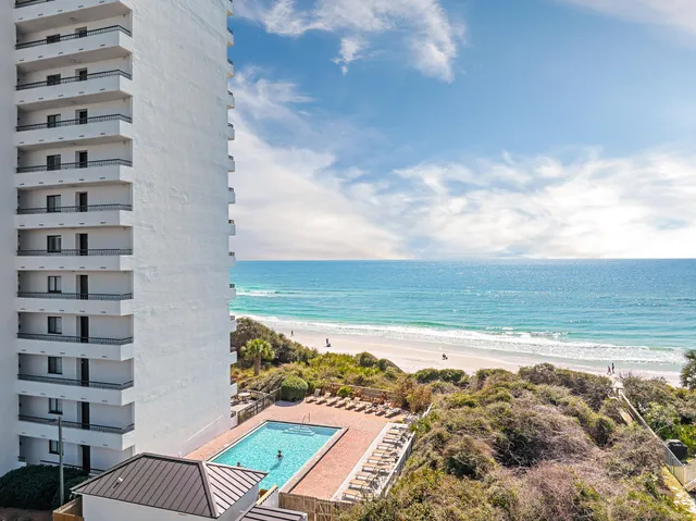 a view of ocean with a multi story building