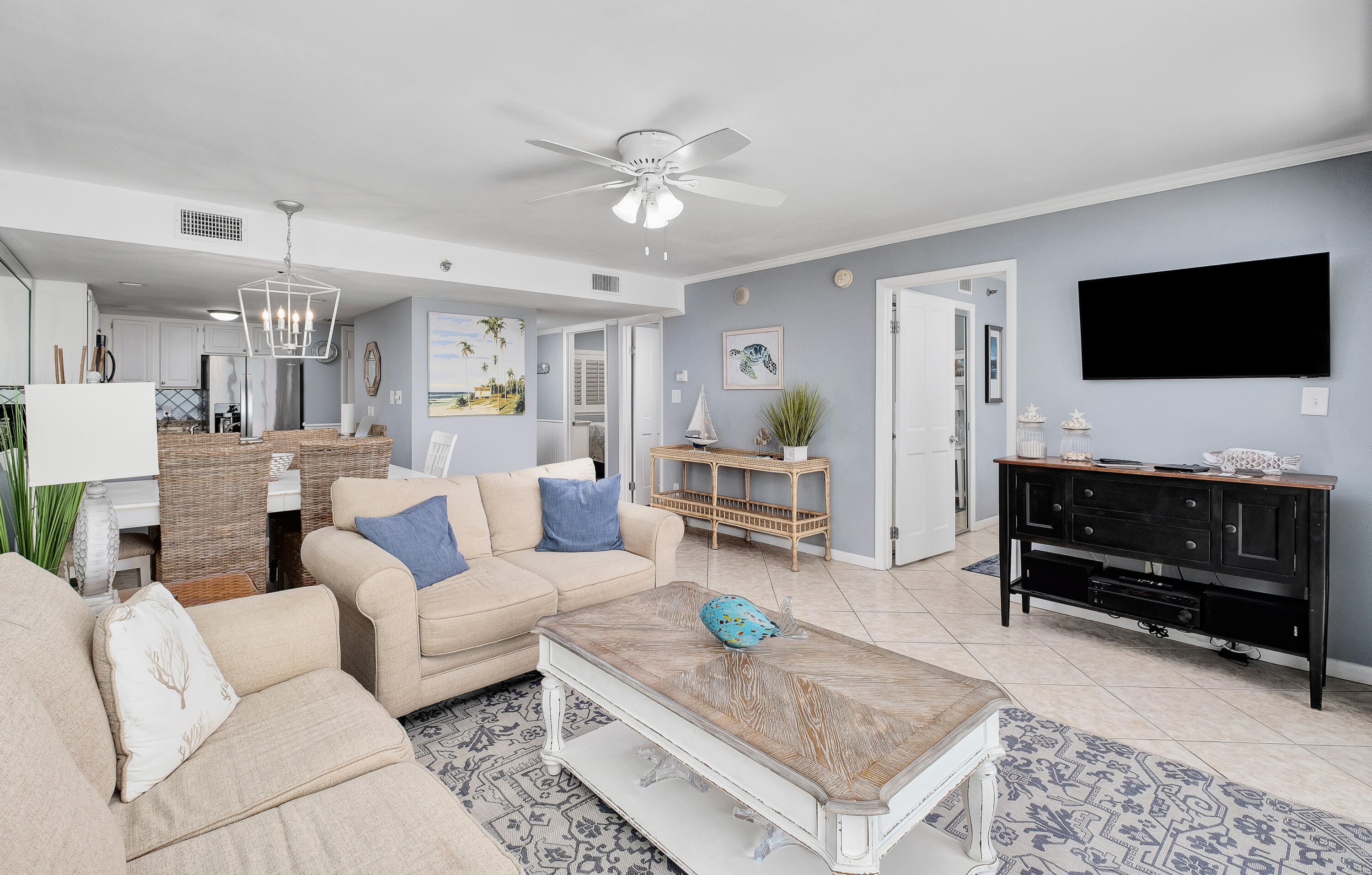 4100 East County Highway 30A, Unit 902 Santa Rosa Beach, FL 32459 - Photo 9 of 54 a living room with furniture and a flat screen tv
