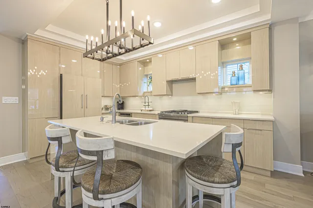 a kitchen with a dining table and chairs