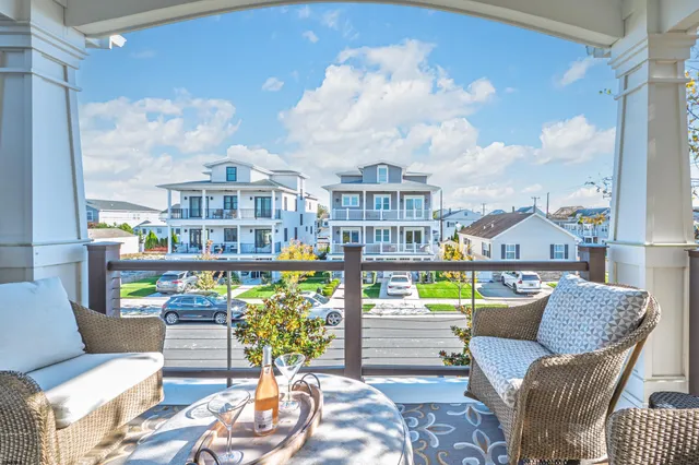 a view of a balcony with chairs