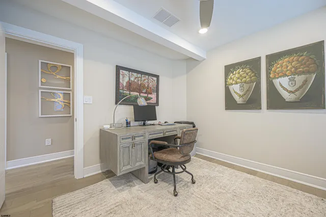 a view of a workspace with furniture