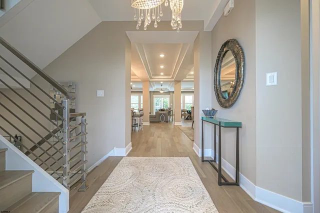 a view of a hallway view with wooden floor and staircase