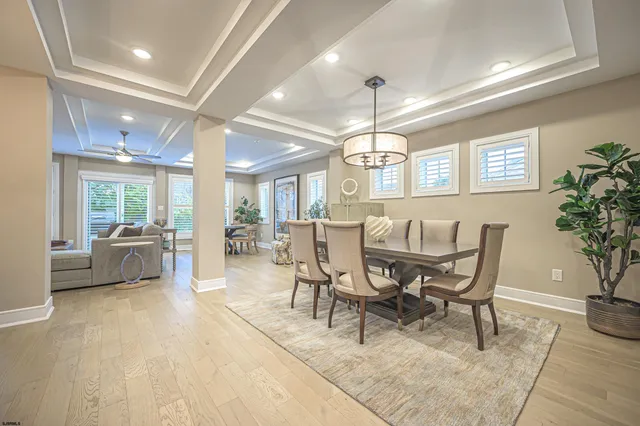a view of a dining room with furniture and a livingroom