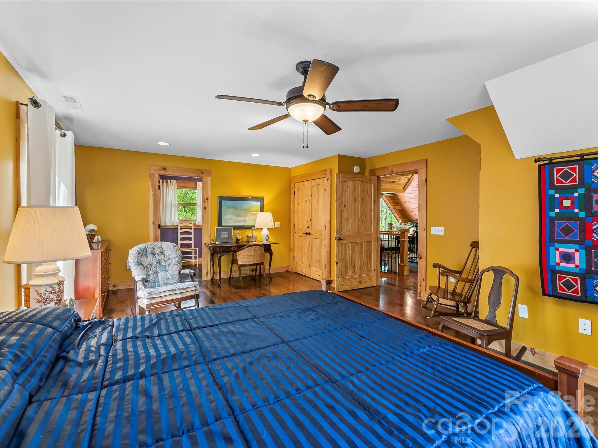 917 Otter Mountain Road Topton, NC 28781 - Photo 36 of 48 a bedroom with furniture and wooden floor