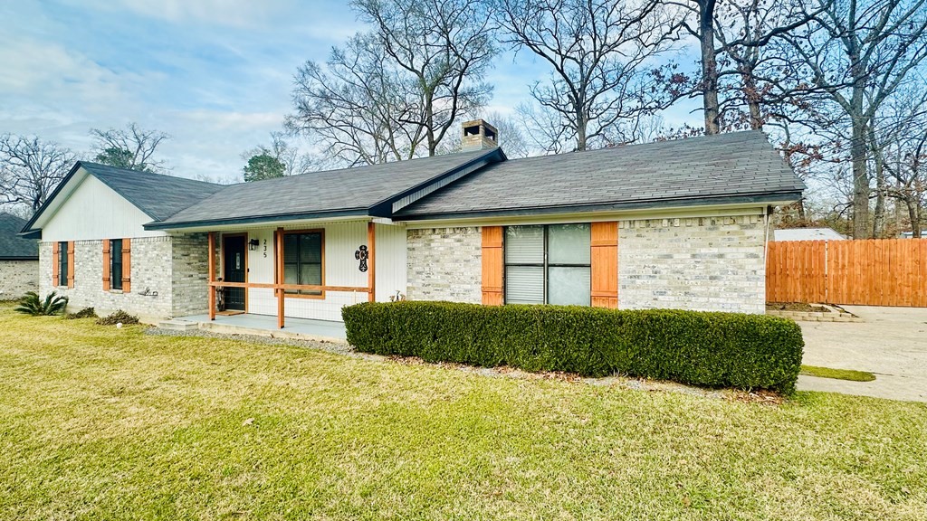 235 Spring Branch Street Lufkin, TX 75904 - Photo 24 of 30 a front view of a house with a garden