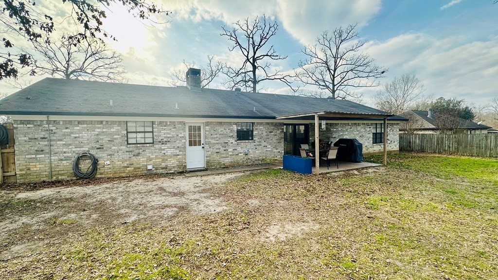 235 Spring Branch Street Lufkin, TX 75904 - Photo 26 of 30 a view of a house with a sink and a yard
