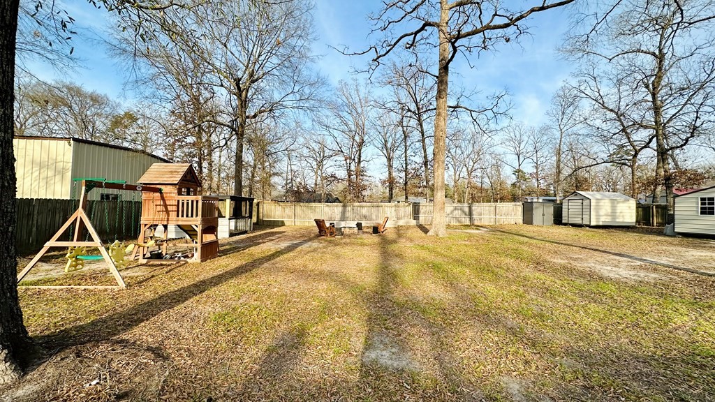 235 Spring Branch Street Lufkin, TX 75904 - Photo 30 of 30 a view of a yard with basketball court