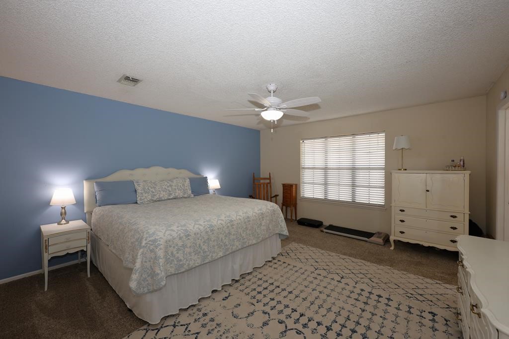 235 Spring Branch Street Lufkin, TX 75904 - Photo 4 of 30 a bedroom with a bed and a window
