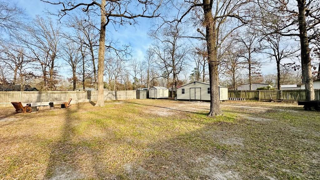 235 Spring Branch Street Lufkin, TX 75904 - Photo 5 of 30 a view of yard with trees