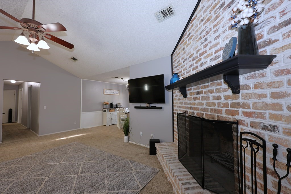 235 Spring Branch Street Lufkin, TX 75904 - Photo 7 of 30 a living room with furniture and a flat screen tv