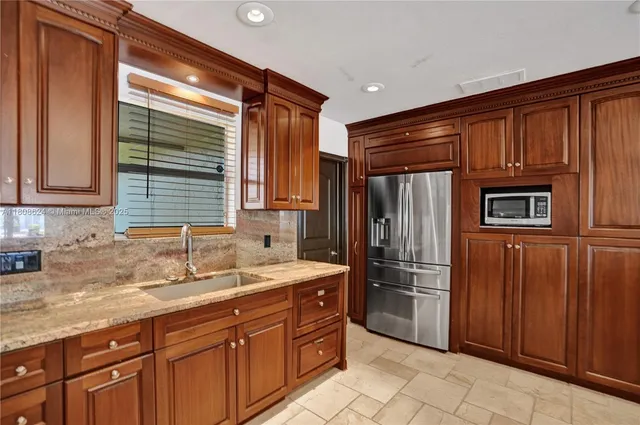 a bedroom with a bed and a mirror