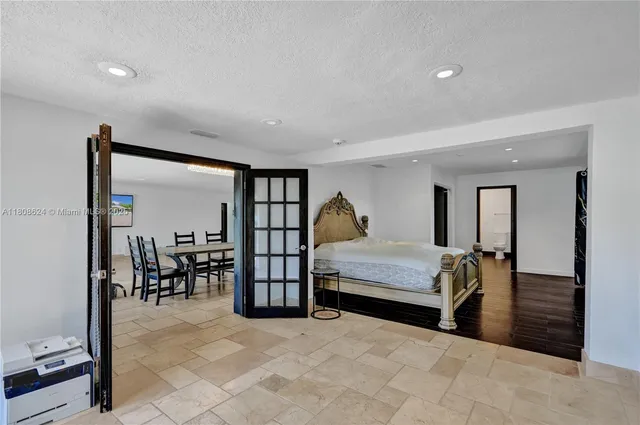 a bathroom with a double vanity sink toilet and shower