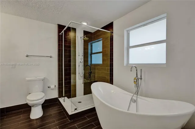 a view of a room with a flat screen tv