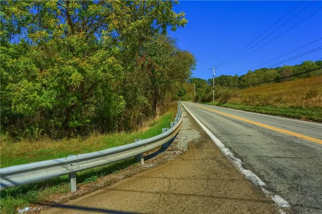 a view of a yard with a lake view