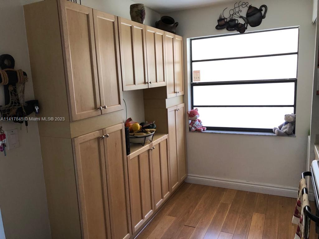 450 Commodore Drive, Unit 211 Plantation, FL 33325 - Photo 3 of 12 a view of a closet