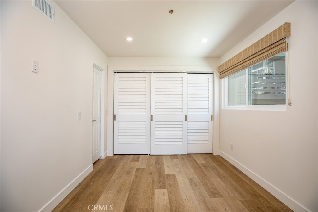 280 Dolphin Way Laguna Beach, CA 92651 - Photo 13 of 34 wooden floor in an empty room with a window
