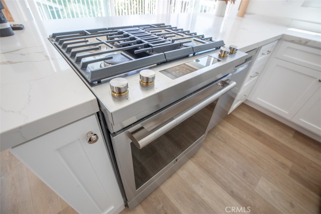 280 Dolphin Way Laguna Beach, CA 92651 - Photo 21 of 34 a stove top oven sitting inside of a kitchen