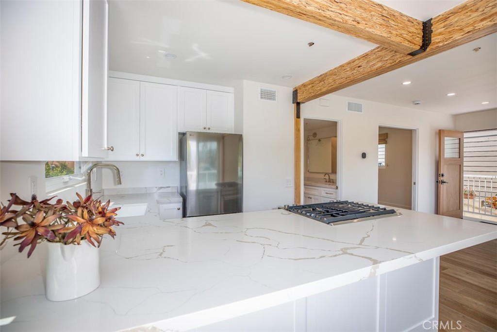 280 Dolphin Way Laguna Beach, CA 92651 - Photo 9 of 34 a kitchen with a sink and refrigerator
