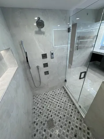 a bedroom with a bed and a television