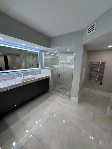 a living room with furniture a dining table and kitchen view