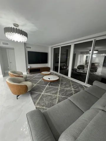 a bed sitting in a room next to a window