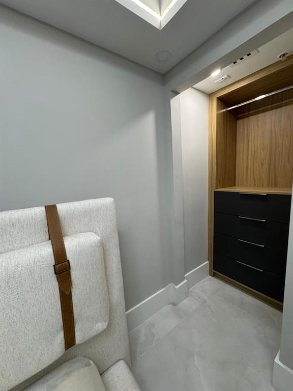 2051 Southeast 3rd Street, Unit 406 Deerfield Beach, FL 33441 - Photo 29 of 61 a bedroom with a bed and furniture