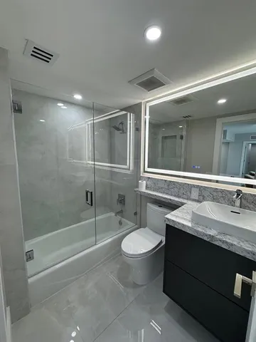 a view of a big room with air conditioner and window