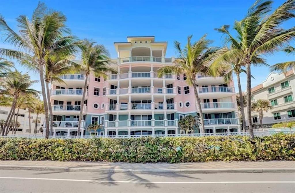 2051 Southeast 3rd Street, Unit 406 Deerfield Beach, FL 33441 - Photo 3 of 61 a front view of a multi story building