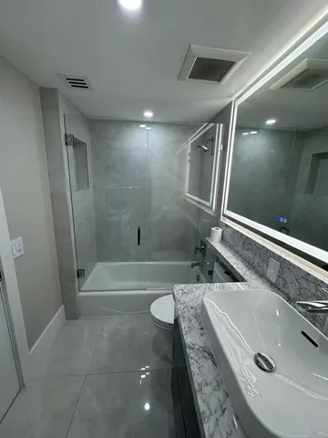 a living room with a table and chairs