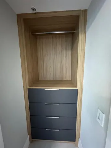 a kitchen with cabinets and a sink