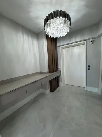 a kitchen with kitchen island a counter top space a sink stainless steel appliances and cabinets