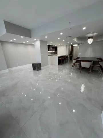 a view of an empty room with a fireplace