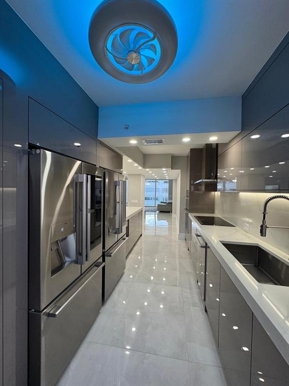 2051 Southeast 3rd Street, Unit 406 Deerfield Beach, FL 33441 - Photo 4 of 61 a kitchen with stainless steel appliances granite countertop a refrigerator and a sink